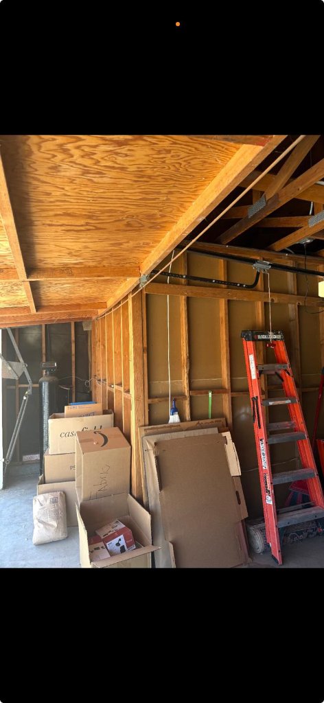 MSB Garage Door Repair technician completing modern dark wood garage door installation at Los Angeles home