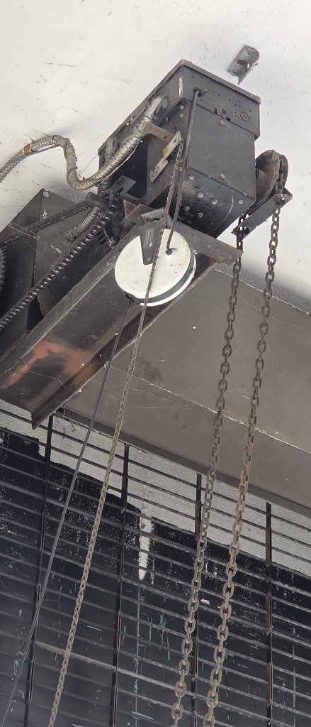 Roll-up garage door damage repair at Marina del Rey waterfront property showing before state